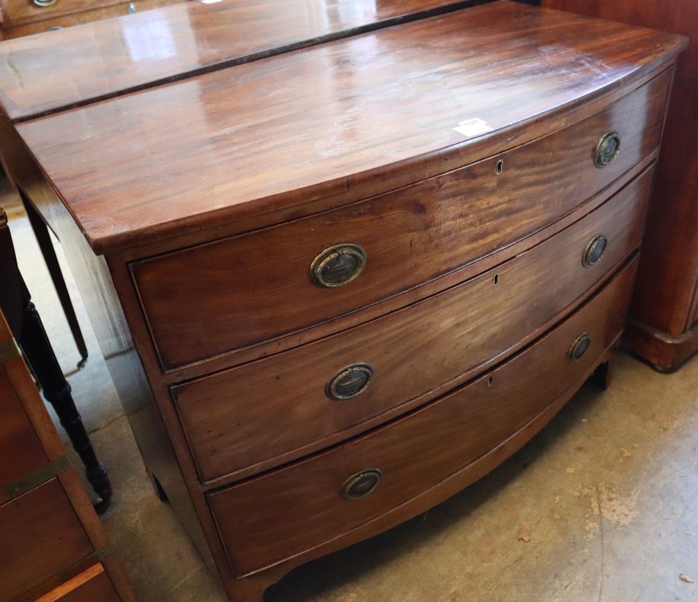 A Regency mahogany bowfronted chest of three graduated long drawers, width 113cm